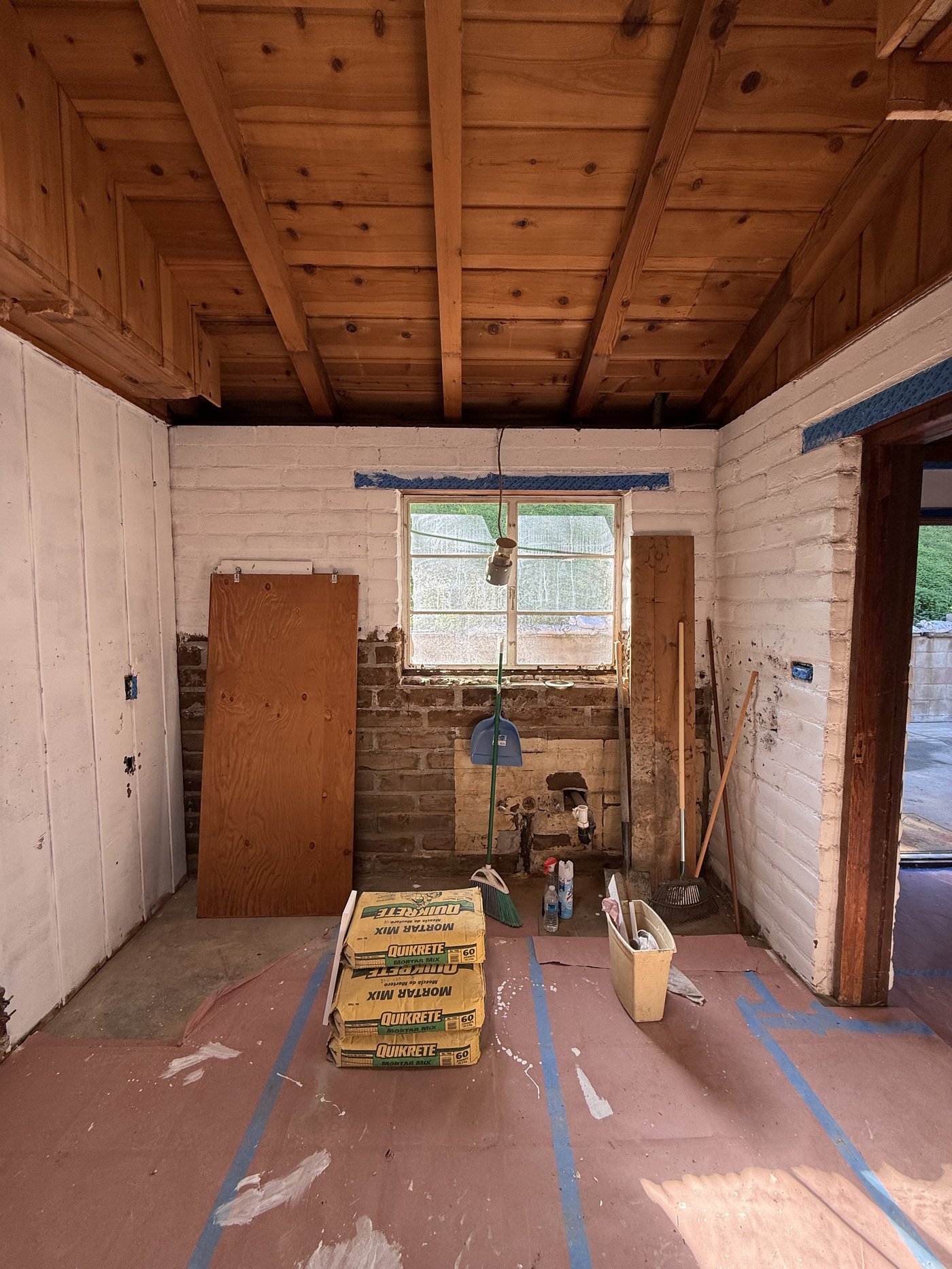 Kitchen gutted down to studs and block wall during renovation